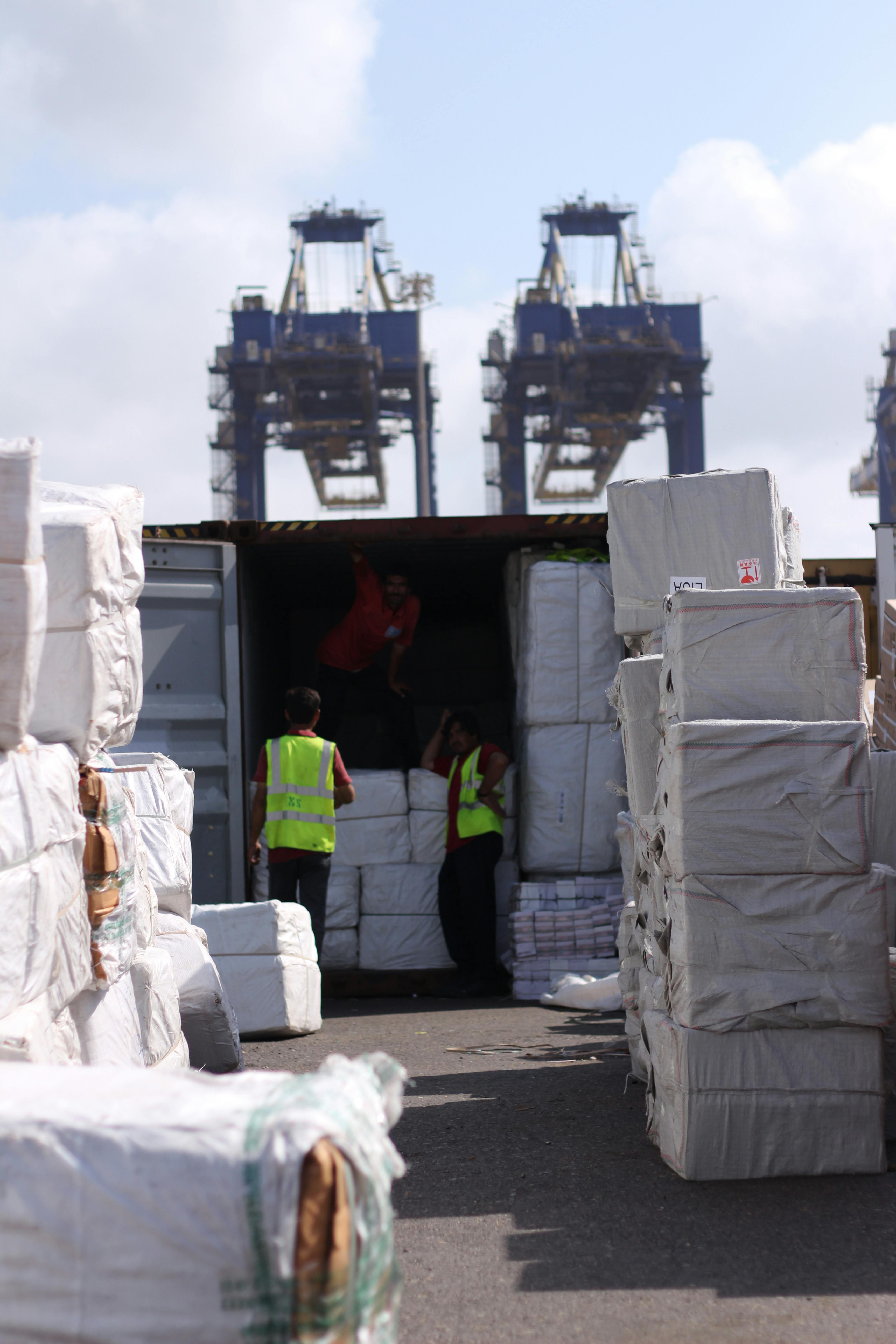 Vehicles loaded inside export shipping containers